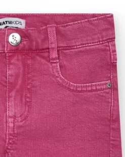 Short pour fille en rose avec poches et fermeture à bouton.