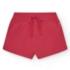 Short pour fille en rouge avec taille élastique et poches.