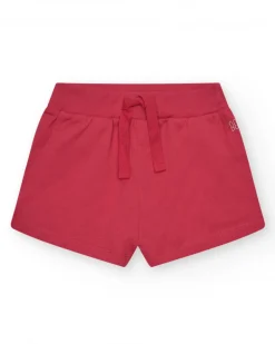 Short pour fille en rouge avec taille élastique et poches.