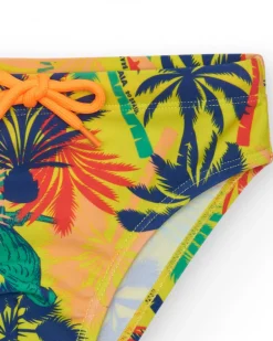 Slip de bain multicolore pour garçon avec imprimé tropical et cordon contrastant.