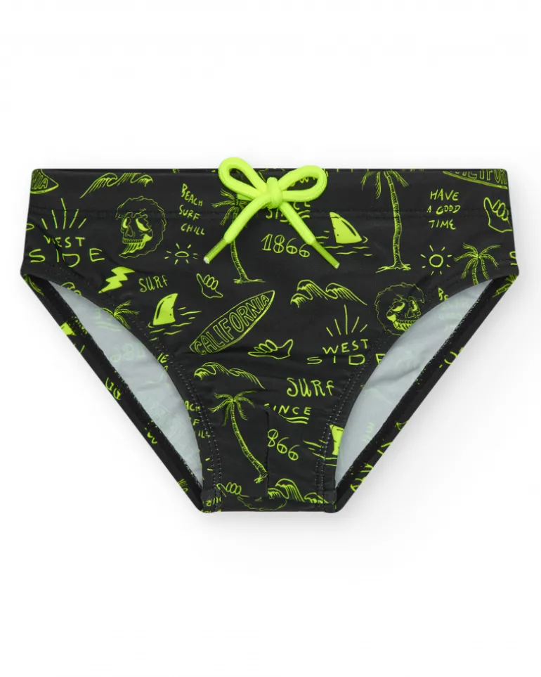 Slip de bain noir pour garçon avec imprimé surfeur et cordon fluo.