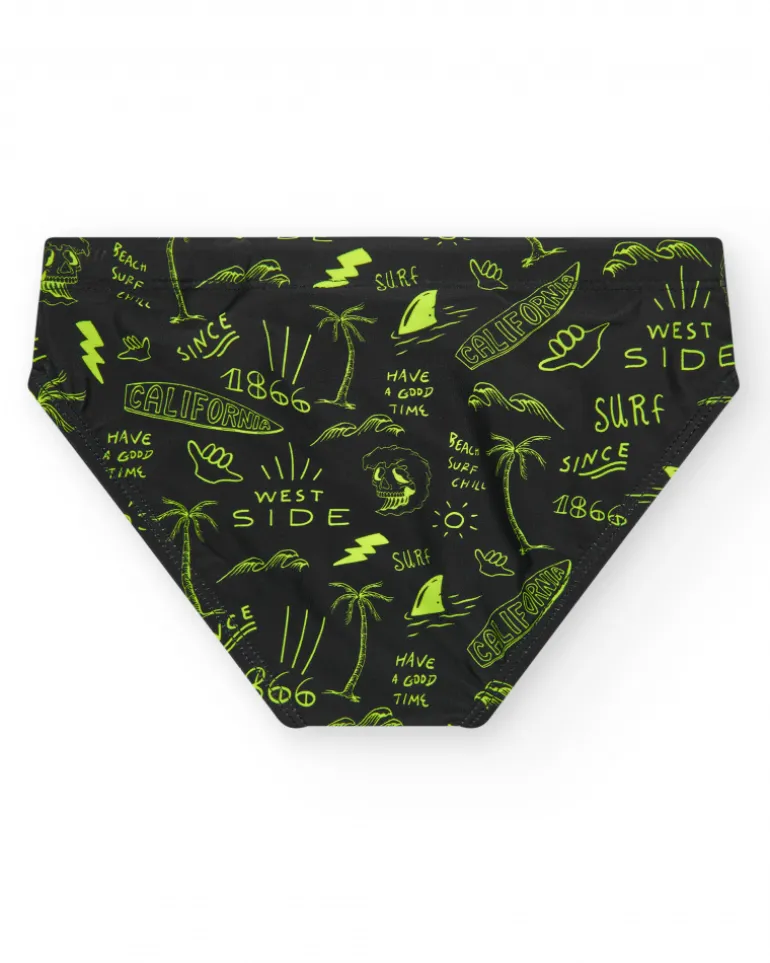 Slip de bain noir pour garçon avec imprimé surfeur et cordon fluo.