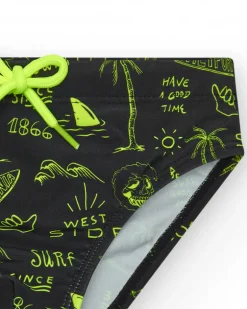 Slip de bain noir pour garçon avec imprimé surfeur et cordon fluo.