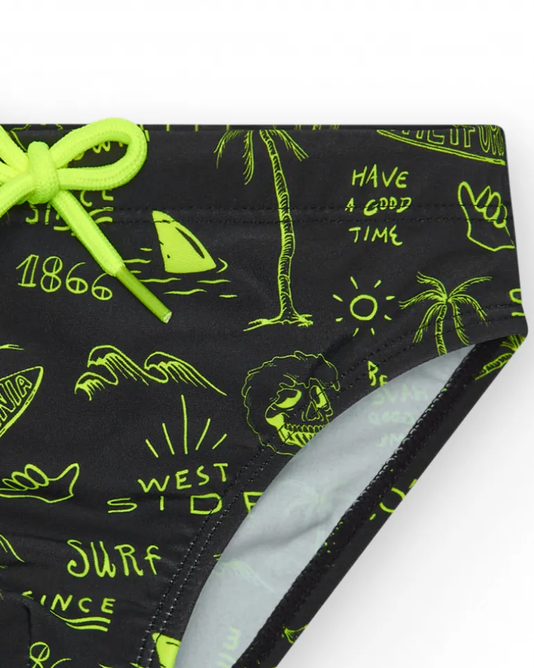 Slip de bain noir pour garçon avec imprimé surfeur et cordon fluo.