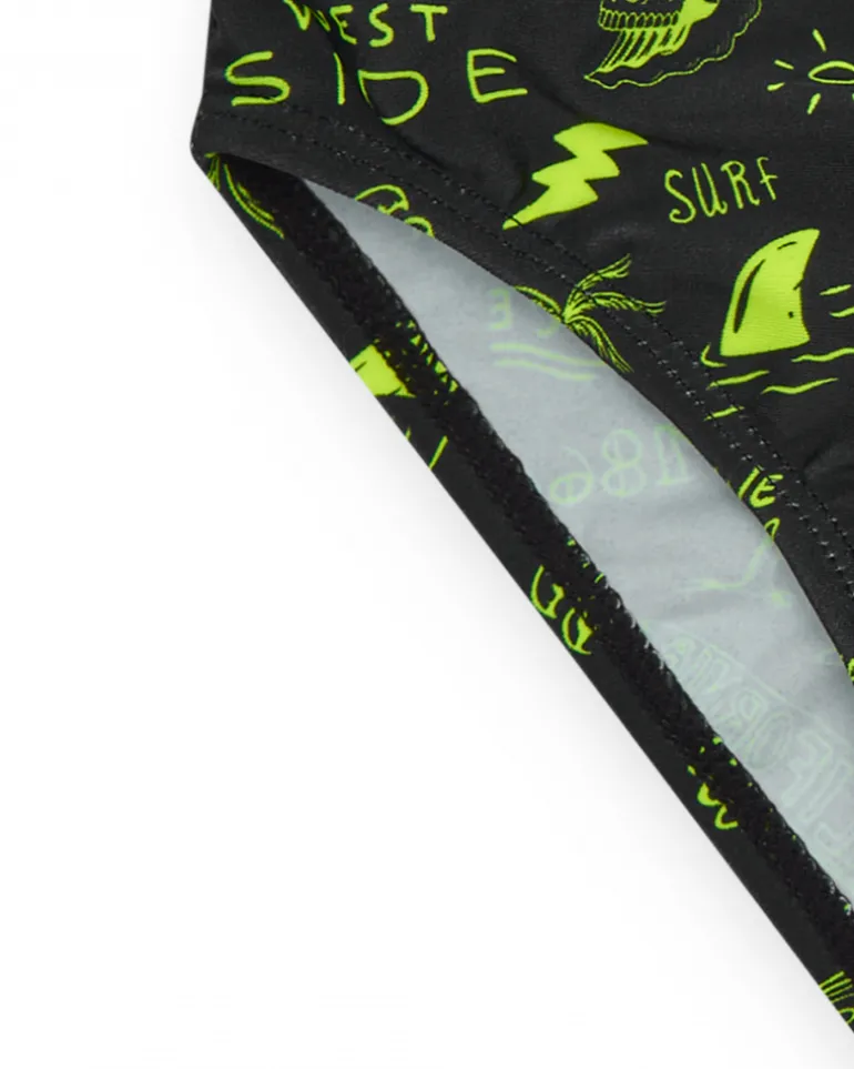 Slip de bain noir pour garçon avec imprimé surfeur et cordon fluo.