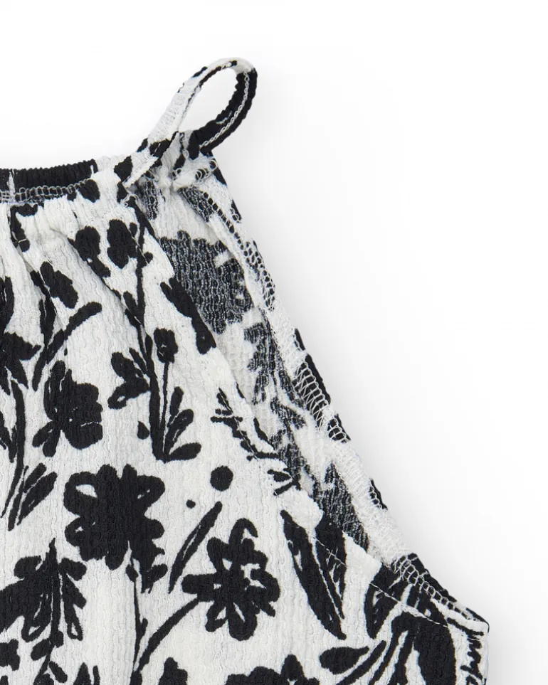 Top pour fille en blanc avec bretelles et imprimé floral.