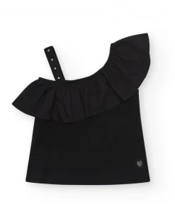 Top pour fille en noir avec design asymétrique et clous métalliques.