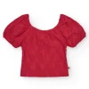T-shirt à manches courtes pour fille en rouge avec col et manches bouffantes.