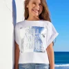 T-shirt à manches courtes pour fille en blanc avec imprimé métallique.