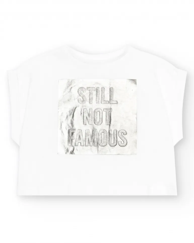 T-shirt à manches courtes pour fille en blanc avec imprimé métallique.
