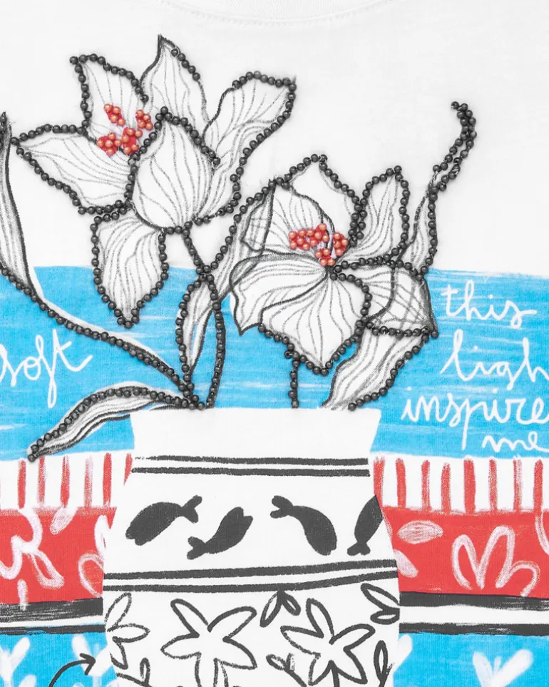 T-shirt à manches courtes pour fille en blanc avec imprimé floral.