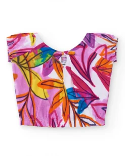 T-shirt pour fille en blanc avec imprimé tropical et nœud dans le dos.