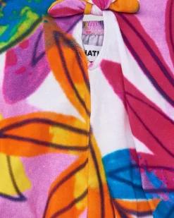T-shirt pour fille en blanc avec imprimé tropical et nœud dans le dos.