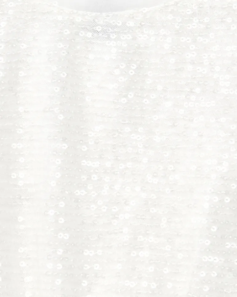 T-shirt pour fille en blanc avec sequins et ourlet élastique.