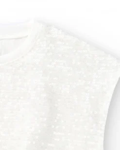 T-shirt pour fille en blanc avec sequins et ourlet élastique.