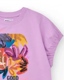 T-shirt pour fille en lilas avec sequins et ourlet courbé.