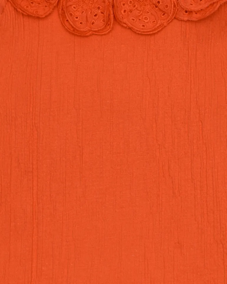 T-shirt pour fille en orange avec volants et broderies.