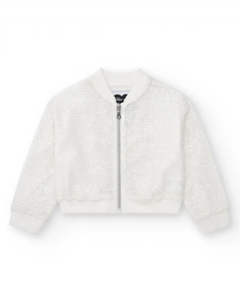 Veste pour fille en blanc avec sequins et fermeture éclair sur le devant.