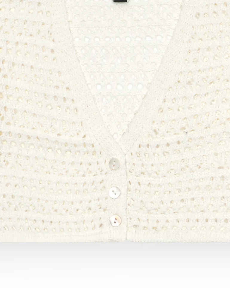 Veste pour fille en blanc avec boutons.