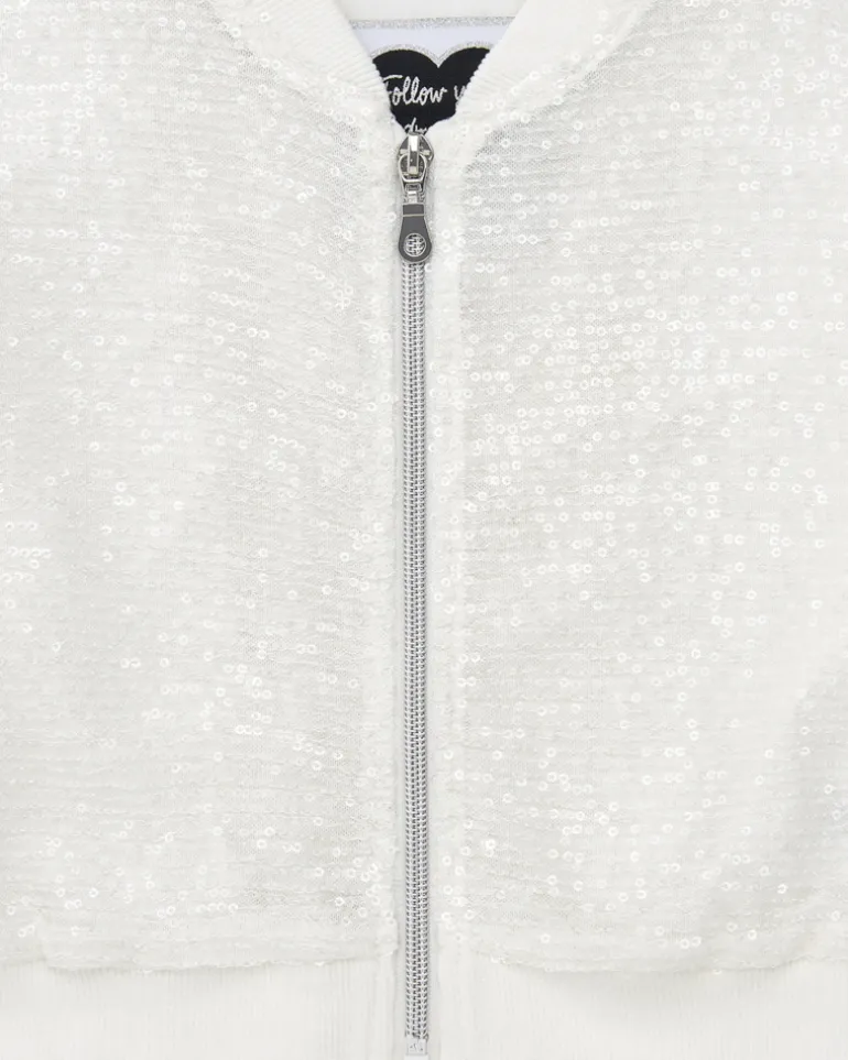Veste pour fille en blanc avec sequins et fermeture éclair sur le devant.