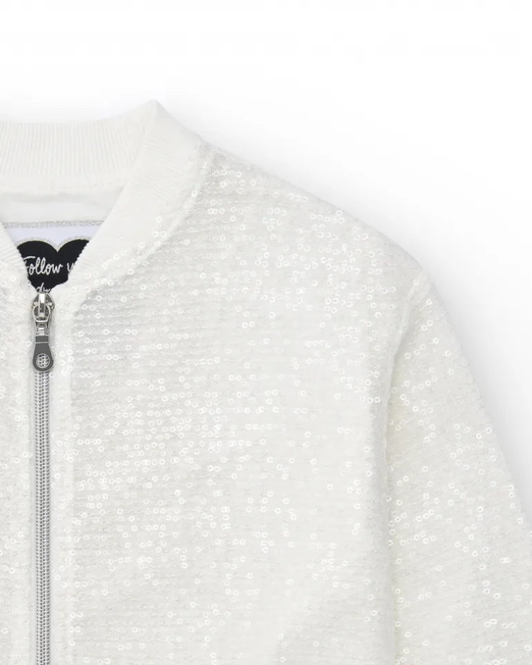 Veste pour fille en blanc avec sequins et fermeture éclair sur le devant.