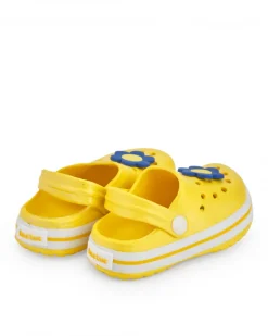 Zuecos para niña en amarillo con flor decorativa